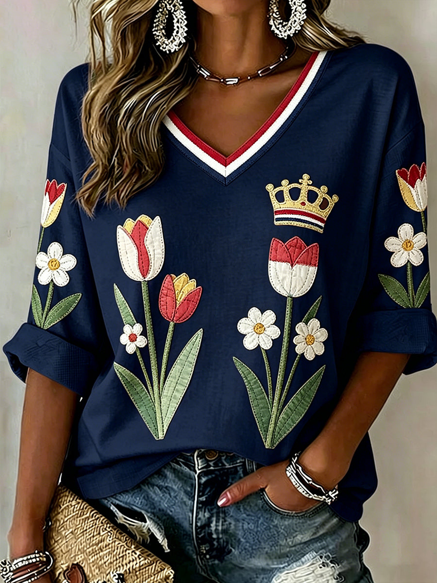 Damesblouse met bloemenpatchworkprint en V-hals