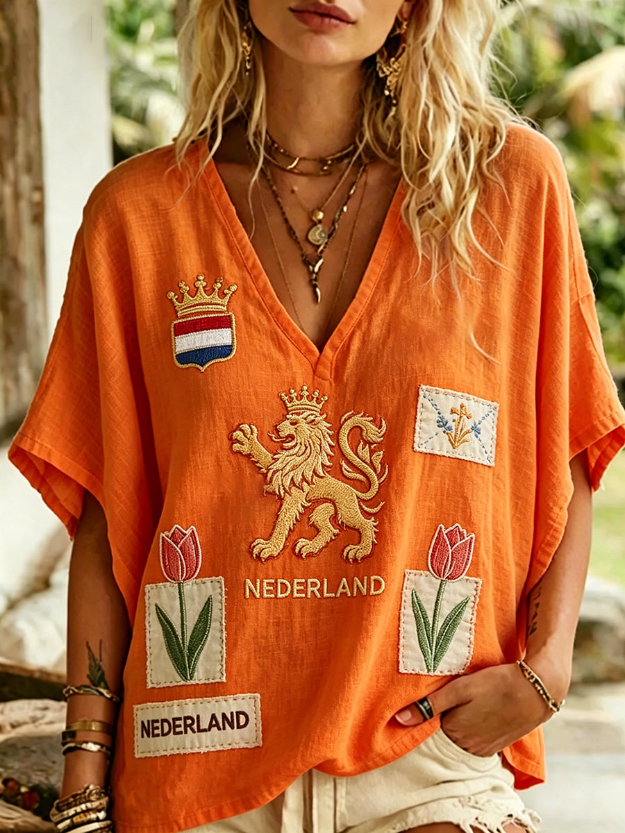 Dames top met leeuwen- en bloemenprint en V-hals