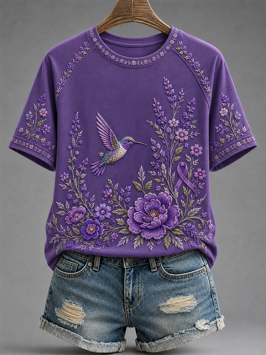 Dames-T-shirt in paars met bloemen- en kolibrieprint ter ondersteuning van het bewustzijn rond Alzheimer