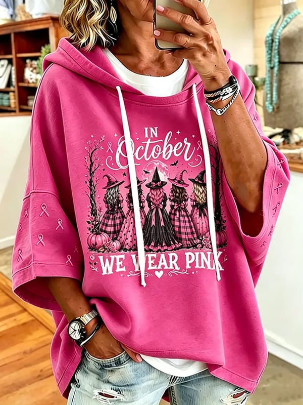 Dameshoodie met korte mouwen en de tekst ‘In oktober dragen we roze’