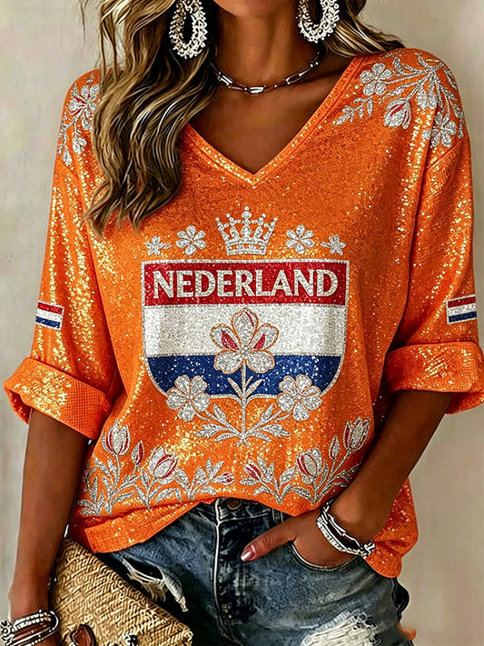 Damesblouse met lovertjes en bloemenprint en V-hals