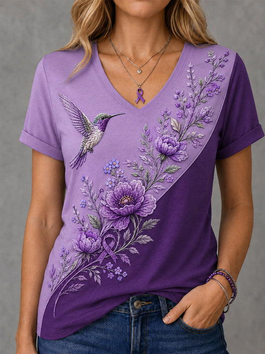 Dames-T-shirt met paarse bloemen- en kolibrieprint ter ondersteuning van het bewustzijn rond Alzheimer, met V-hals