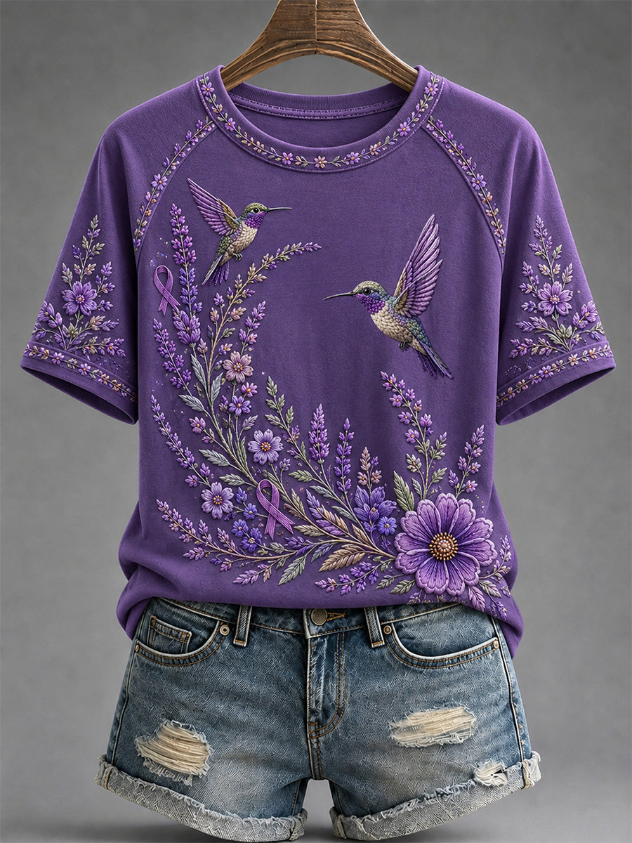 Dames-T-shirt in paars met bloemen- en kolibrieprint ter ondersteuning van het bewustzijn rond Alzheimer