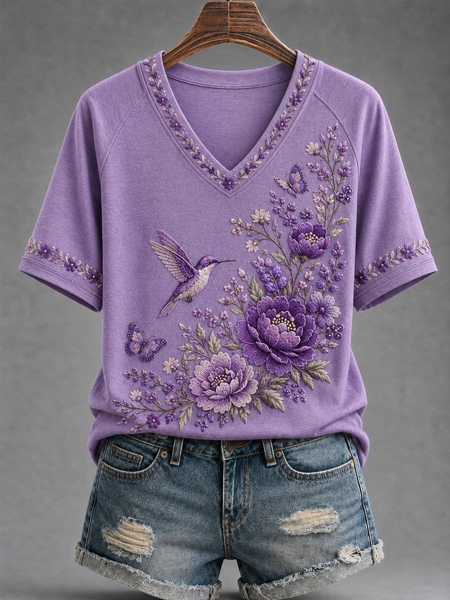 Dames-T-shirt met paarse bloemen- en kolibrieprint ter ondersteuning van het bewustzijn rond Alzheimer, met V-hals