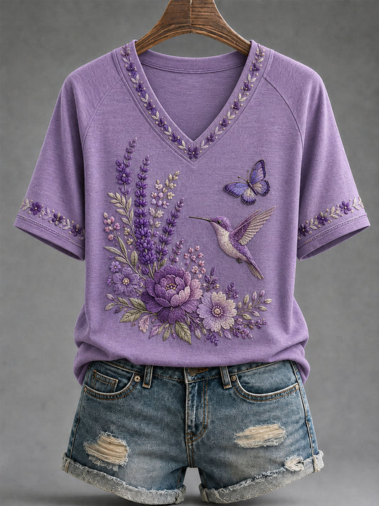 Dames-T-shirt met paarse bloemen- en kolibrieprint ter ondersteuning van het bewustzijn rond Alzheimer, met V-hals