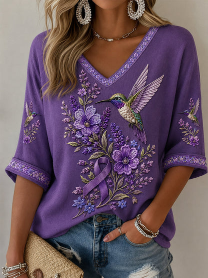 Paars t-shirt voor vrouwen met bloemen- en kolibrieprint, halflange mouwen en V-hals, ter ondersteuning van het bewustzijn rond Alzheimer