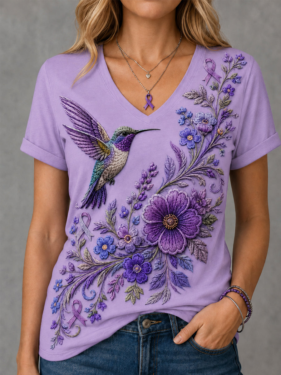 Dames-T-shirt met paarse bloemen- en kolibrieprint ter ondersteuning van het bewustzijn rond Alzheimer, met V-hals