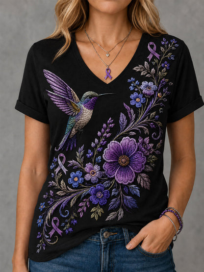 Dames-T-shirt met paarse bloemen- en kolibrieprint ter ondersteuning van het bewustzijn rond Alzheimer, met V-hals
