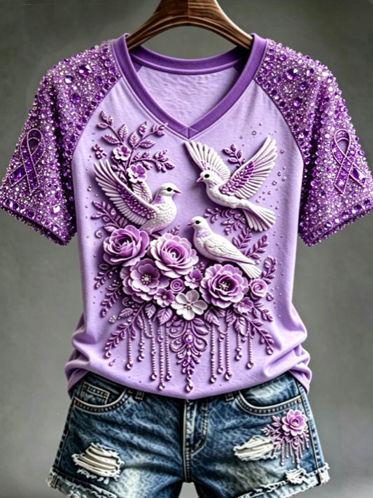Dames-T-shirt met paarse bloemen- en kolibrieprint ter ondersteuning van het bewustzijn rond Alzheimer, met V-hals