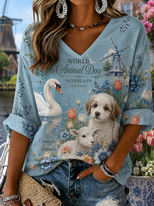 Dameswerelddierendag grafische print V-hals top met lange mouwen