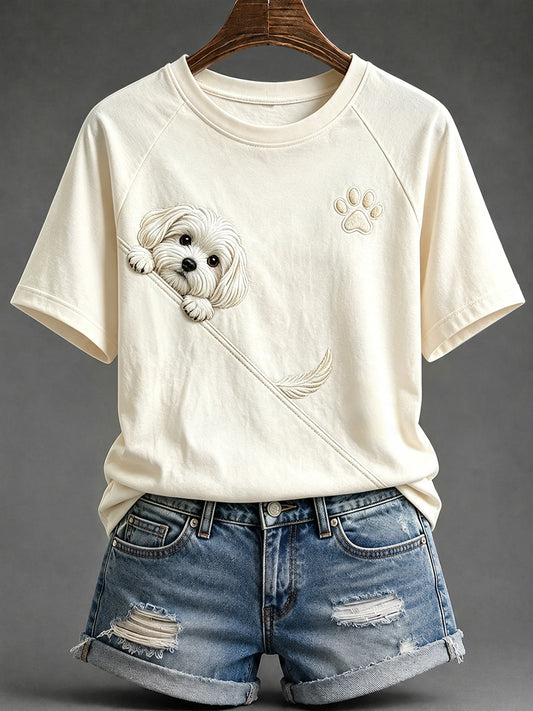 Schattig T-shirt voor dames met een Maltezer hond die nieuwsgierig om de hoek kijkt en een ronde hals, voorzien van pootafdrukken en korte mouwen