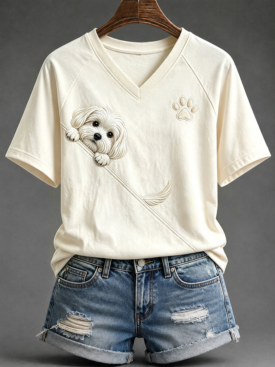 Schattig T-shirt voor dames met een Maltezer hond die nieuwsgierig om de hoek kijkt en een pootafdruk, met V-hals en korte mouwen