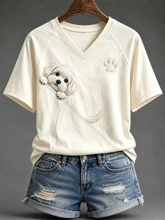 Schattig T-shirt voor dames met een Maltezer hond die nieuwsgierig om de hoek kijkt en een pootafdruk, met V-hals en korte mouwen