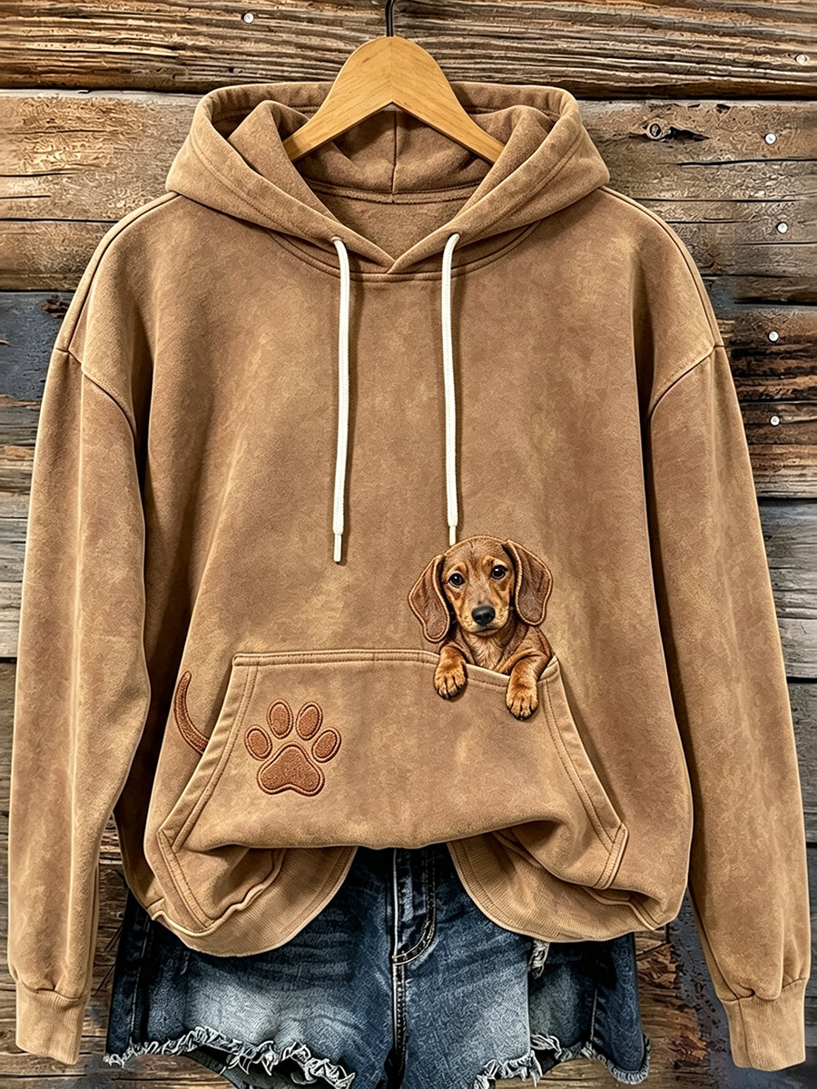 Damessweatshirt met schattige, uitstekende teckelhond en pootafdrukken